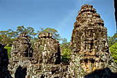 Angkor Thom - Bayon temple, second enclosure, corner towers seen from the central terrace 